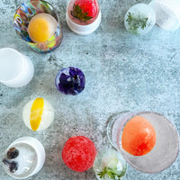 Edible flowers, fruit, herbs,  and berries make for memorable cocktails